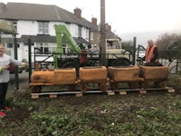 a woman standing next to a wooden train