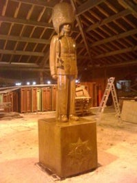 a statue of a soldier standing in a building