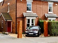 a house with a car parked in front of it